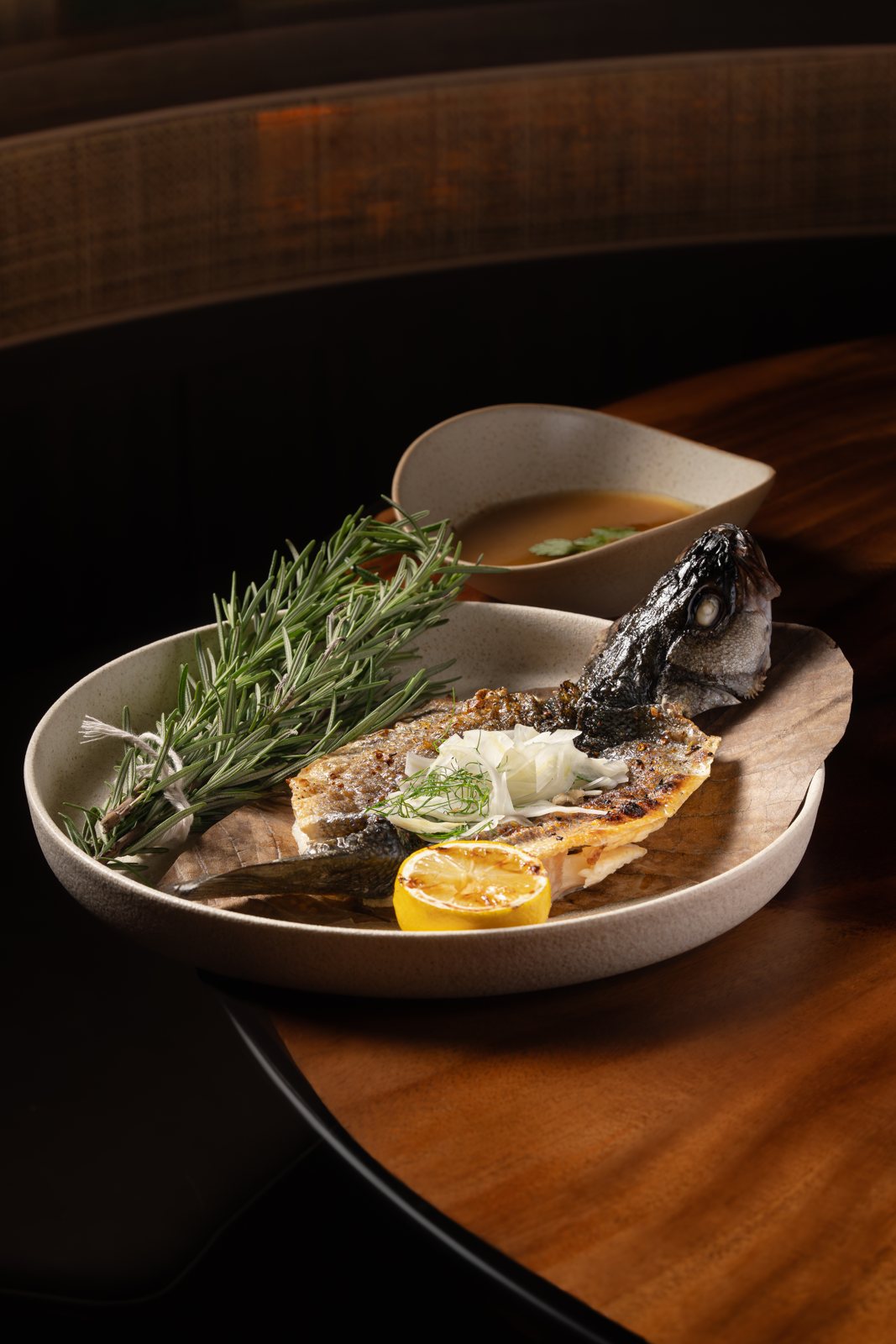 Whole branzino with crispy skin and rosemary at MUI Supper Club