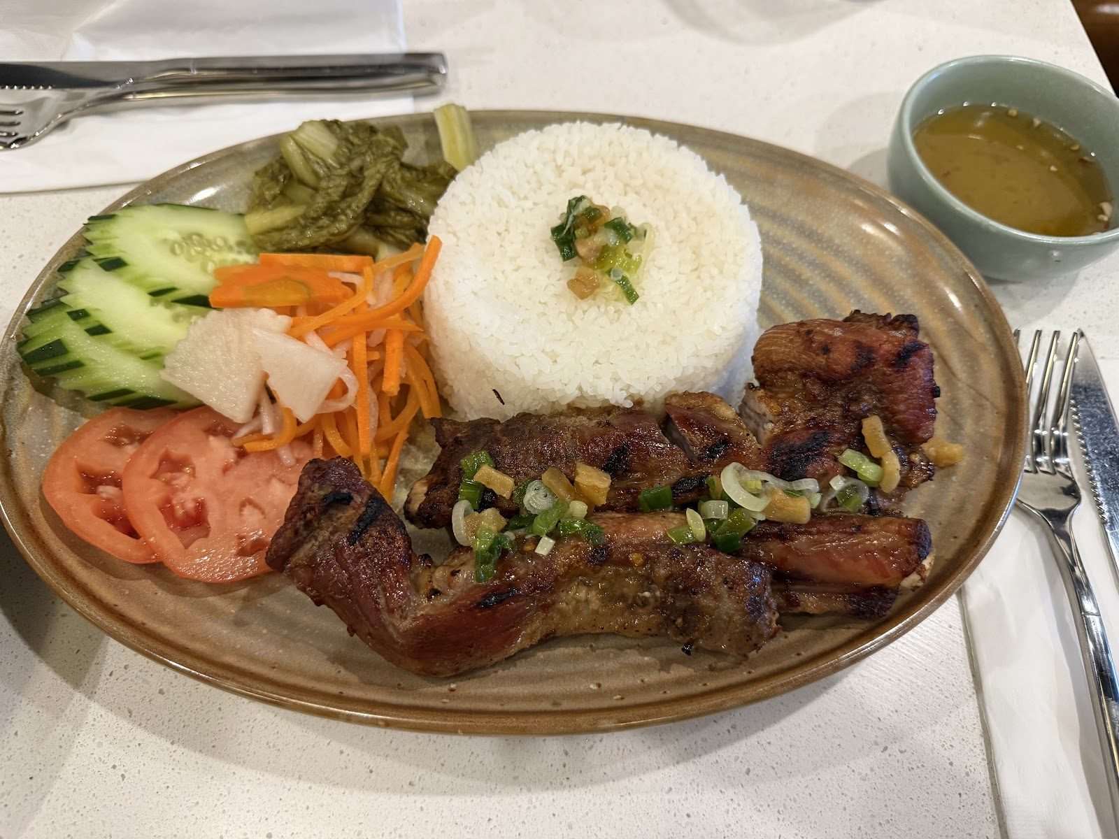 A grilled pork rice plate at TamTam in the Eden Center
